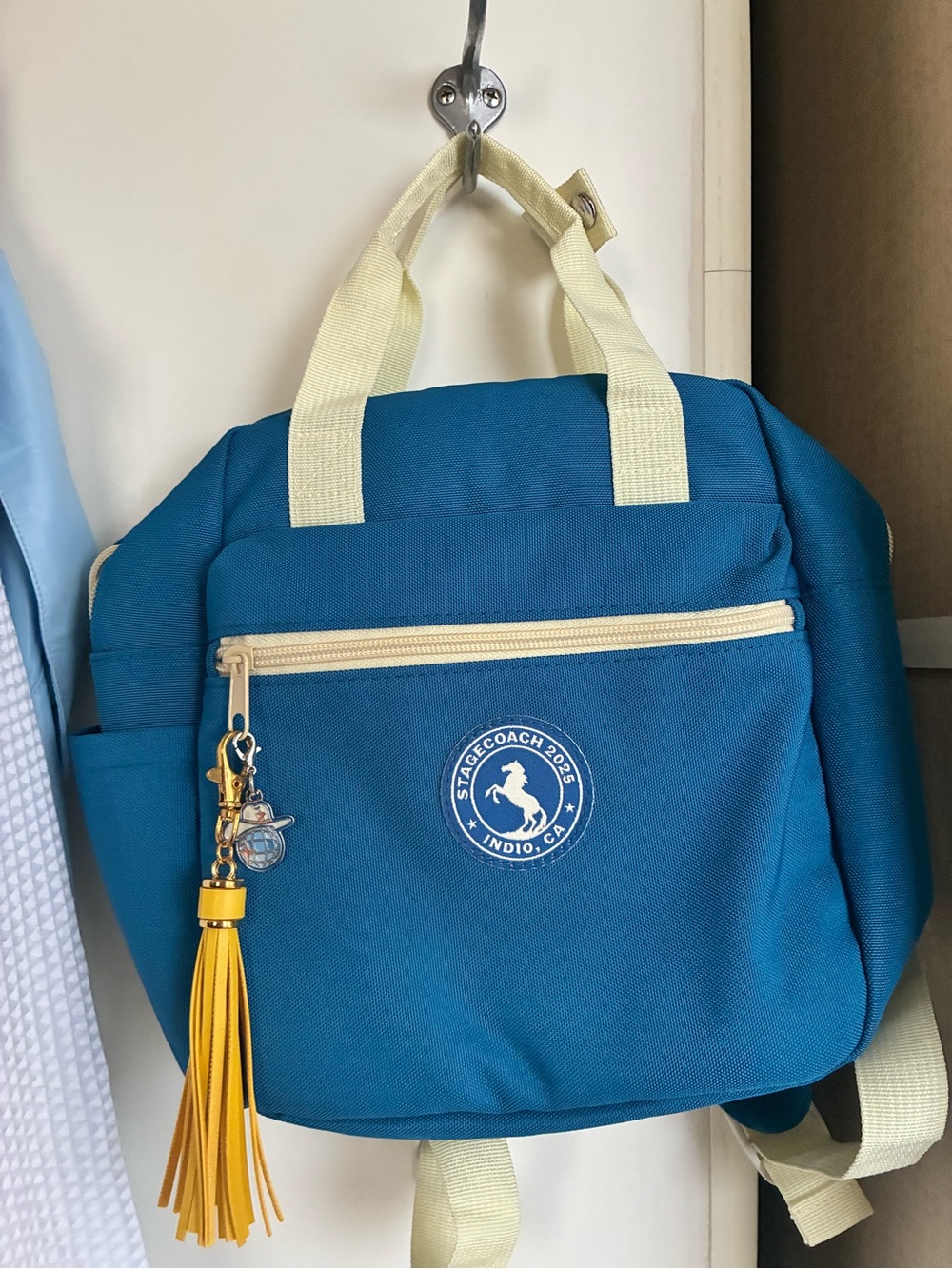 Teal Canvas Backpack with Cream Handles and Yellow Tassel keychain